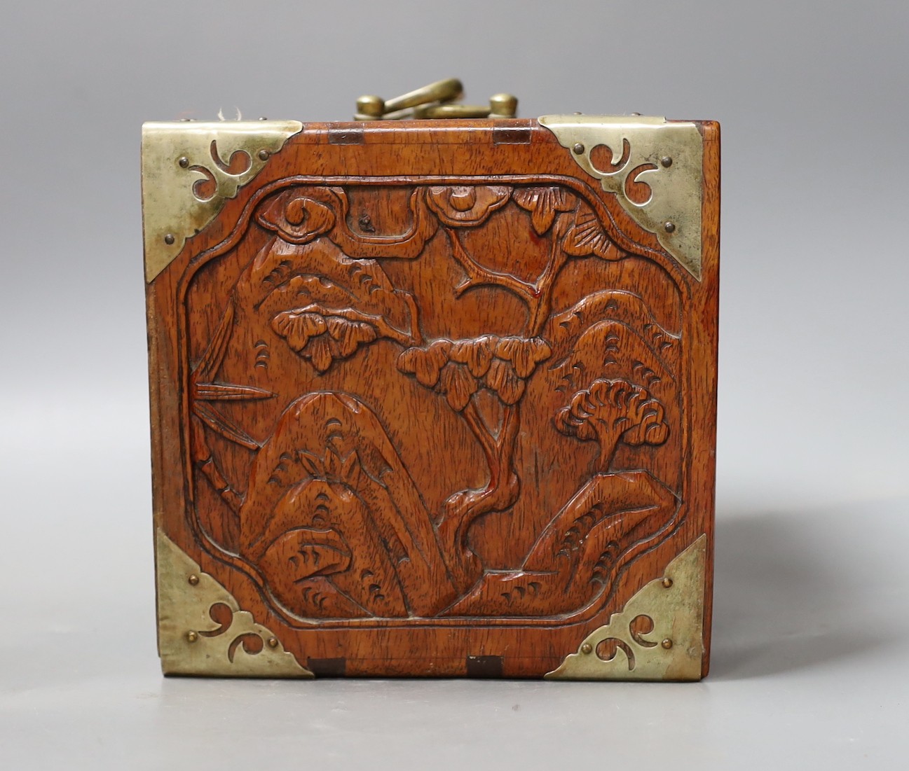 An early 20th century Chinese hardwood cased bone and bamboo mahjong set
